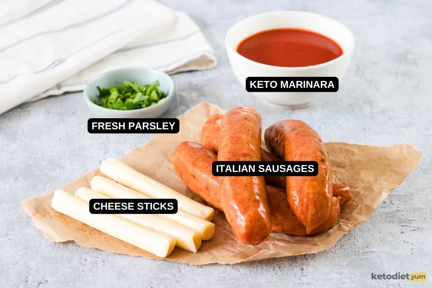 ingredients on a table with Italian sausages, marinara sauce, fresh parsley and mozzarella cheese sticks